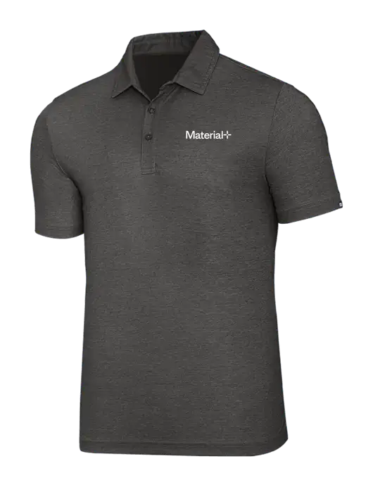 TravisMathew Black Heather Oceanside Polo w/Material+ Logo